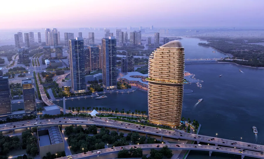 Aerial view of Jumeirah Residences Al Maryah Island at dusk, surrounded by the canal and city towers