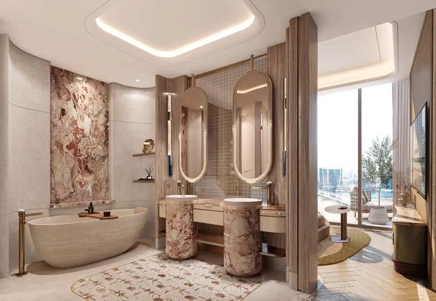 Marble bathroom with freestanding bath and twin vanities at Jumeirah Residences Al Maryah Island