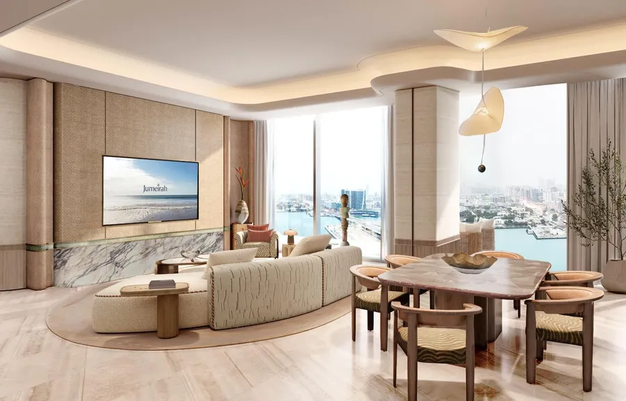 Open-plan living and dining room in a Jumeirah Residences Al Maryah Island apartment with canal views