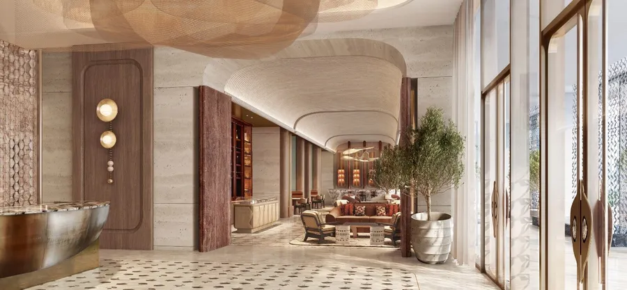 Grand arrival lobby with travertine walls and bespoke seating at Jumeirah Residences Al Maryah Island