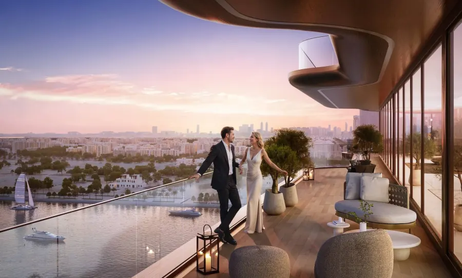 Couple on a private terrace at Jumeirah Residences Al Maryah Island overlooking the skyline at sunset
