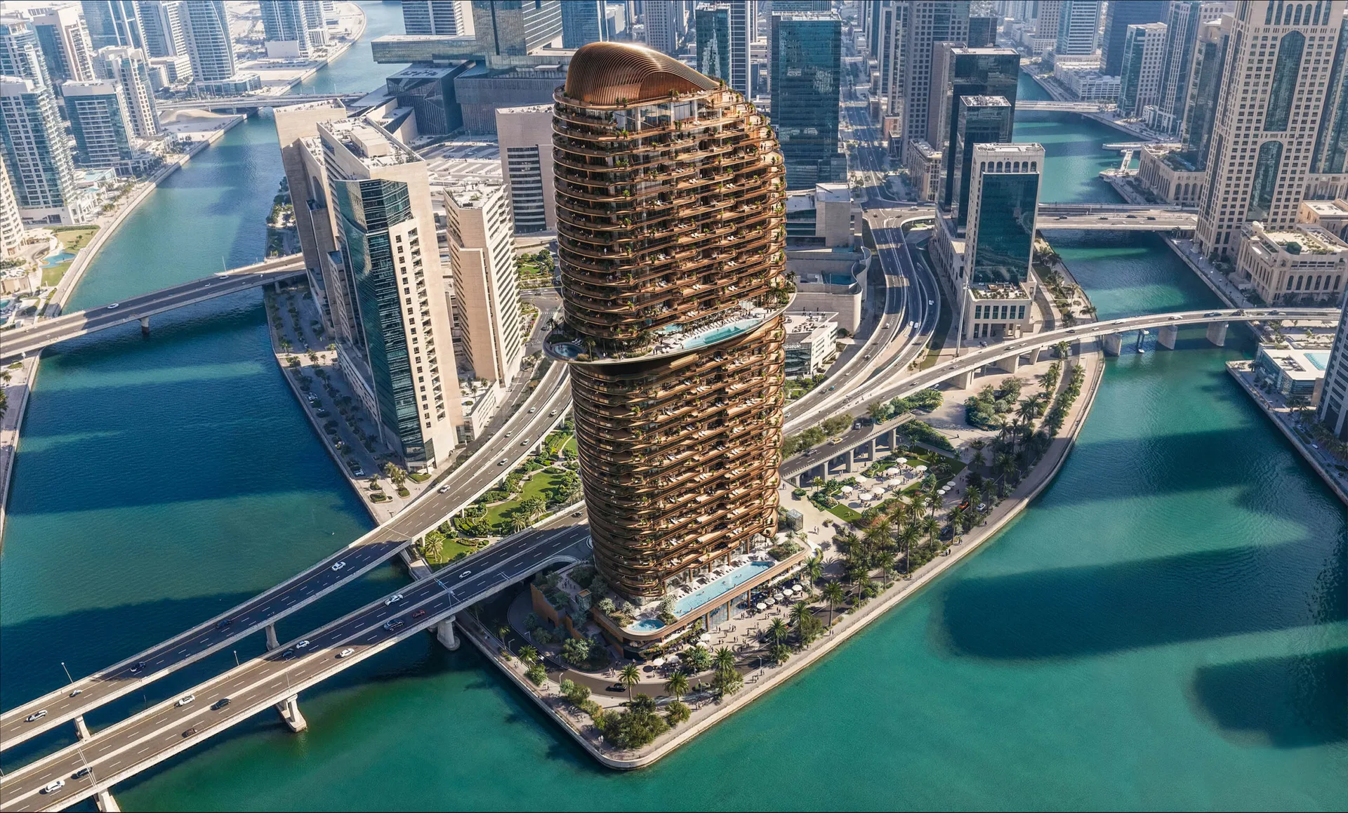 Aerial view of the Jumeirah Residences Al Maryah Island tower on the Abu Dhabi waterfront, framed by the canal, the promenade and the city skyline